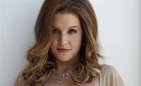 Music recording artist Lisa Marie Presley poses for a portrait in West Hollywood, California May 10, 2012. REUTERS/Mario Anzuoni