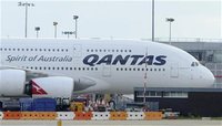 A grounded Qantas aircraft is seen parked at Heathrow Airport in west London October 29, 2011. REUTERS/Paul Hackett