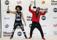 Redfoo (L) and SkyBlu of LMFAO pose with their awards backstage during the Billboard Music Awards at MGM Grand Garden Arena in Las Vegas May