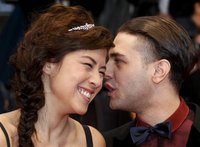Actress Mylene Jampanoi (L) and director Xavier Dolan arrive on the red carpet ahead of the screening of the film "Amour", by director Micha