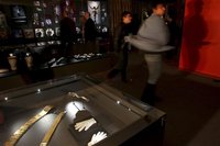A Michael Jackson fan dances during an exhibition at the Fashion Museum in Santiago, May 18, 2012. Sunglasses, jackets, suits, shoes and dif