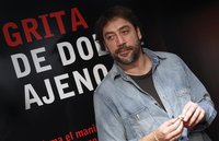 Spanish actor Javier Bardem poses for photographers after the presentation of a campaign by the Spanish NGO 'Medicos Sin Fronteras' (Medics 