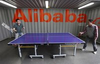 Employees play table tennis inside the headquarters office of Alibaba (China) Technology Co. Ltd on the outskirts of Hangzhou, Zhejiang prov
