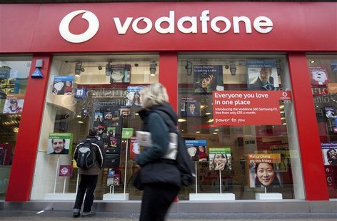 A pedestrian passes a Vodafone store on Oxford Street in central London, November 10, 2009. REUTERS/Kevin Coombs A pedestrian passes a Vodafone store on Oxford Street in central London, November 10, 2009. REUTERS/Kevin Coombs