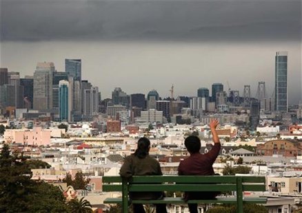 Two men look out over the San Francisco skyline from above Dolores Park, following a rain shower in San Francisco, California May 3, 2012. R Two men look out over the San Francisco skyline from above Dolores Park, following a rain shower in San Francisco, California May 3, 2012. R