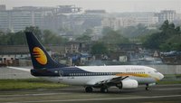 A Jet Airways aircraft waits for take off on the tarmac at the airport in Mumbai September 13, 2009. REUTERS/Punit Paranjpe