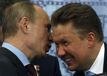 President Vladimir Putin (L) speaks with Alexei Miller, CEO of Russian energy supplier Gazprom, during his visit to the Russian Geographical President Vladimir Putin (L) speaks with Alexei Miller, CEO of Russian energy supplier Gazprom, during his visit to the Russian Geographical