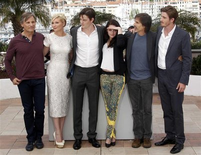 Director Walter Salles (2ndR) and cast members (LtoR) Viggo Mortensen, Kirsten Dunst, Sam Riley, Kristen Stewart and Garret Hedlund pose dur Director Walter Salles (2ndR) and cast members (LtoR) Viggo Mortensen, Kirsten Dunst, Sam Riley, Kristen Stewart and Garret Hedlund pose dur