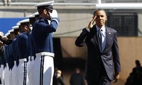 U.S. President Barack Obama salutes as he arrives for the Air Force Academy commencement ceremony in Colorado Springs, Colorado May 23, 2012