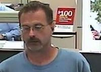 Picture of alleged bank robbery captured by bank surveillance camera used to identify and capture the suspect. (photo courtesy of Battle Creek Police}