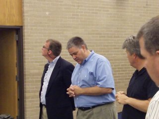 Zeeland Board of Education President Tom DenHerder (C) opens a special meeting on May 24, 2012, into possible disciplinary action against Superintendent Dave Barry.