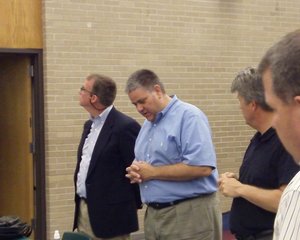 Zeeland Board of Education President Tom DenHerder (C) opens a special meeting on May 24, 2012, into possible disciplinary action against Superintendent Dave Barry.