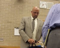 Zeeland School Superintendent Dr. Dave Barry prepares to leave a special Board of Education meeting on May 24, 2012, after he was suspended for two weeks by the panel for admitted plagiarism.