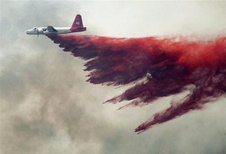 A Cal Fire aircraft drops flame retardant on the Topaz Ranch Estates Fire in Wellington, Nevada May 23, 2012. Evacuations were lifted today A Cal Fire aircraft drops flame retardant on the Topaz Ranch Estates Fire in Wellington, Nevada May 23, 2012. Evacuations were lifted today