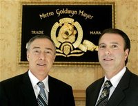 Harry E. Sloan (R) Chairman and CEO and Rick Sands (L) Chief Operating Officer of movie studio Metro-Goldwyn-Mayer Inc. pose for photographs