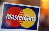 A MasterCard logo is seen on a door outside a restaurant in New York, February 3, 2010. REUTERS/Shannon Stapleton