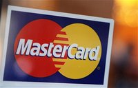 A MasterCard logo is seen on a door outside a restaurant in New York, February 3, 2010. REUTERS/Shannon Stapleton