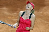 Maria Sharapova of Russia celebrates after defeating Li Na of China in their final match at the Rome Masters tennis tournament May 20, 2012.