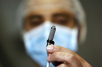 An Italian heart surgeon holds a tiny titanium pump, the world's smallest artificial heart, which was implanted in a baby, at the Bambino Ge