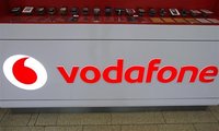 The Vodafone logo is seen at the counter of the shop in Prague February 7, 2012. REUTERS/David W Cerny