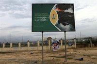 A signboard campaigning against oil pipeline vandalism is seen along a road in Yenagoa in Nigeria's Bayelsa state May 15, 2012. Picture take