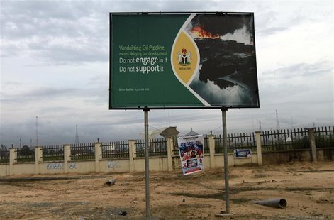 A signboard campaigning against oil pipeline vandalism is seen along a road in Yenagoa in Nigeria's Bayelsa state May 15, 2012. Picture take A signboard campaigning against oil pipeline vandalism is seen along a road in Yenagoa in Nigeria's Bayelsa state May 15, 2012. Picture take