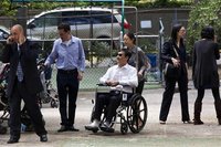 REFILE - CORRECTING IDENTITY OF WOMAN Chen Guangcheng, the blind Chinese dissident and legal advocate who recently sought asylum in the Unit