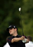 Zach Johnson of the U.S. plays a tee shot on the practice ground during the first practice day of the American Express Championship golf tou