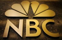 An NBC sign on the General Electric building in New York October 5, 2009. REUTERS/Mike Segar
