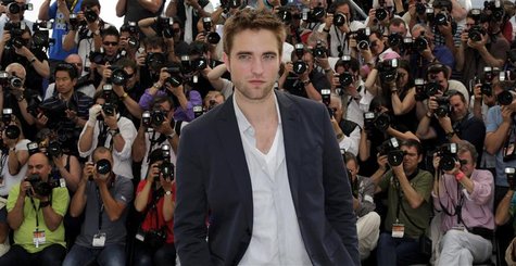 Cast member Robert Pattinson poses during a photocall for the film "Cosmopolis", in competition at the 65th Cannes Film Festival May 25, 201 Cast member Robert Pattinson poses during a photocall for the film "Cosmopolis", in competition at the 65th Cannes Film Festival May 25, 201