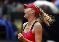 Maria Sharapova of Russia celebrates after winning the final match against Li Na of China at the Rome Masters tennis tournament May 20, 2012