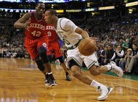 Boston Celtics' Avery Bradley (R) drives past Philadelphia 76ers' Elton Brand during the first half of Game 2 of their NBA Eastern Conferenc