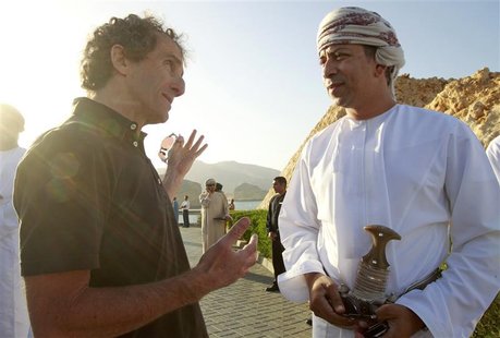 Head of Muscat municipality Sultan bin Hamdoon Al Harthi listens to former Formula One world champion Alain Prost of France after the the in Head of Muscat municipality Sultan bin Hamdoon Al Harthi listens to former Formula One world champion Alain Prost of France after the the in