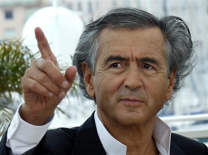 Director Bernard-Henry Levy poses during a photocall for the film "Le Serment de Tobrouk" at the 65th Cannes Film Festival, May 25, 2012. RE Director Bernard-Henry Levy poses during a photocall for the film "Le Serment de Tobrouk" at the 65th Cannes Film Festival, May 25, 2012. RE