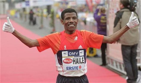 Ethiopian world marathon record holder Haile Gebrselassie celebrates after winning the half marathon race during the Vienna City Marathon in Ethiopian world marathon record holder Haile Gebrselassie celebrates after winning the half marathon race during the Vienna City Marathon in