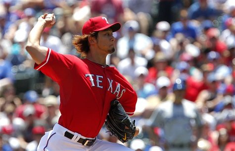 Texas Rangers pitcher Yu Darvish throws against the Toronto Blue Jays in the first inning of their MLB American League baseball game in Arli