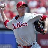 Philadelphia Phillies starting pitcher Roy Halladay delivers a pitch to a St. Louis Cardinals batter during the first inning of their MLB Na