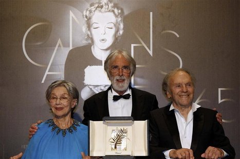 Director Michael Haneke poses with actors Emmanuelle Riva (L) and Jean-Louis Trintignant (R) during a photocall after receiving the Palme d' Director Michael Haneke poses with actors Emmanuelle Riva (L) and Jean-Louis Trintignant (R) during a photocall after receiving the Palme d'