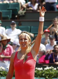 Victoria Azarenka of Belarus waves after winning her match against Alberta Brianti of Italy during the French Open tennis tournament at the Victoria Azarenka of Belarus waves after winning her match against Alberta Brianti of Italy during the French Open tennis tournament at the
