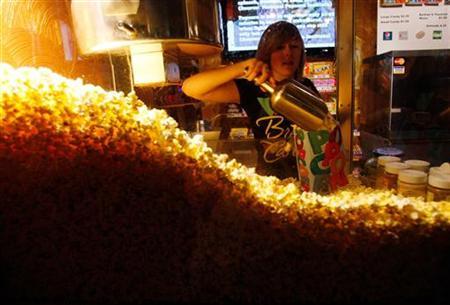 Cailynn Williams, 17, fills a bag of popcorn for a customer at the New Strand Theater in West Liberty, Iowa July 8, 2011.
Credit: Reuters/Jessica Rinaldi
Cailynn Williams, 17, fills a bag of popcorn for a customer at the New Strand Theater in West Liberty, Iowa July 8, 2011.
Credit: Reuters/Jessica Rinaldi