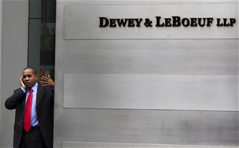 A man talks on his phone behind the sign, outside of the building housing the law firm Dewey & LeBoeuf LLP in New York, May 8, 2012. REUTERS A man talks on his phone behind the sign, outside of the building housing the law firm Dewey & LeBoeuf LLP in New York, May 8, 2012. REUTERS