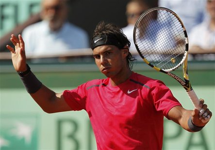 Rafael Nadal of Spain reacts during his match against Simone Bolelli of Italy during the French Open tennis tournament at the Roland Garros Rafael Nadal of Spain reacts during his match against Simone Bolelli of Italy during the French Open tennis tournament at the Roland Garros