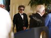 Musician Bob Dylan (C) arrives prior to receiving a Presidential Medal of Freedom in the East Room of the White House in Washington, May 29,