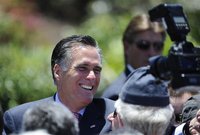 Mitt Romney, U.S. Republican presidential candidate and former Massachusetts governor, shakes hands with supporters during a memorial day ce