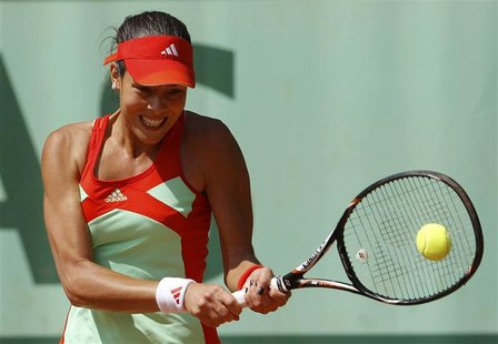 Ana Ivanovic of Serbia returns the ball to Shahar Peer of Israel during the French Open tennis tournament at the Roland Garros stadium in Pa Ana Ivanovic of Serbia returns the ball to Shahar Peer of Israel during the French Open tennis tournament at the Roland Garros stadium in Pa