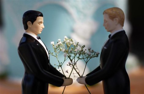A same-sex wedding cake topper is seen outside the East Los Angeles County Recorder's Office on Valentine's Day during a news event for Nati A same-sex wedding cake topper is seen outside the East Los Angeles County Recorder's Office on Valentine's Day during a news event for Nati