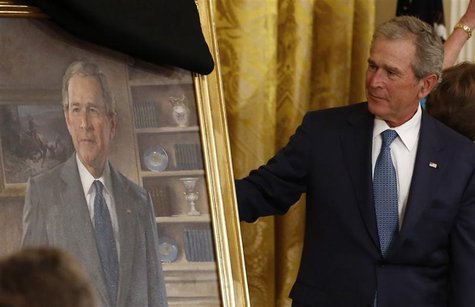 Former U.S. President George W. Bush unveils his official White House portrait during a ceremony in the East Room of the White House in Wash Former U.S. President George W. Bush unveils his official White House portrait during a ceremony in the East Room of the White House in Wash
