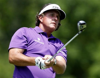 Phil Mickelson of the U.S. watches his tee shot on the third hole during the first round of the Memorial Tournament at Muirfield Village Gol Phil Mickelson of the U.S. watches his tee shot on the third hole during the first round of the Memorial Tournament at Muirfield Village Gol