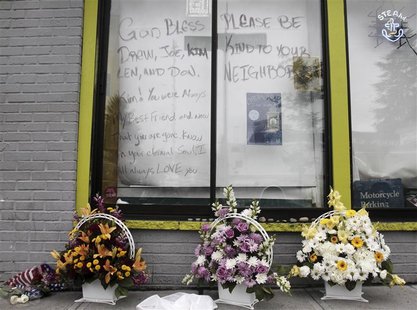 Flowers sit outside the Cafe Racer after Wednesday's deadly shooting incident in Seattle, Washington, May 31, 2012. A gunman killed four peo Flowers sit outside the Cafe Racer after Wednesday's deadly shooting incident in Seattle, Washington, May 31, 2012. A gunman killed four peo