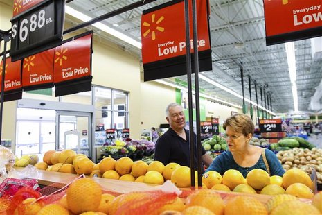 Wal-Mart shareholders Bob and Sharon Frye shop at a Wal-Mart Neighborhood Market store in Bentonville, Arkansas, May 31, 2012. REUTERS/Jacob Wal-Mart shareholders Bob and Sharon Frye shop at a Wal-Mart Neighborhood Market store in Bentonville, Arkansas, May 31, 2012. REUTERS/Jacob